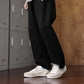 SNK AeroStitch Trainer Vintage Cream on feet, standing streetwear look