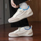 SNK AeroStitch Trainer Vintage Cream on feet, leg raised close-up