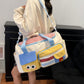 Canyon Dreamhood Series Duffel Sunny Chick, cream with red gingham top and yellow face pocket