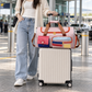 Pink Flamingo duffel on a suitcase at the airport