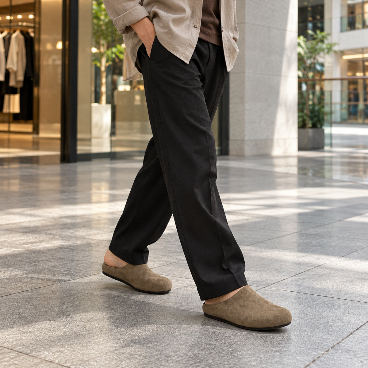 Man wearing SNK Nomad Comfort Mule in a mall