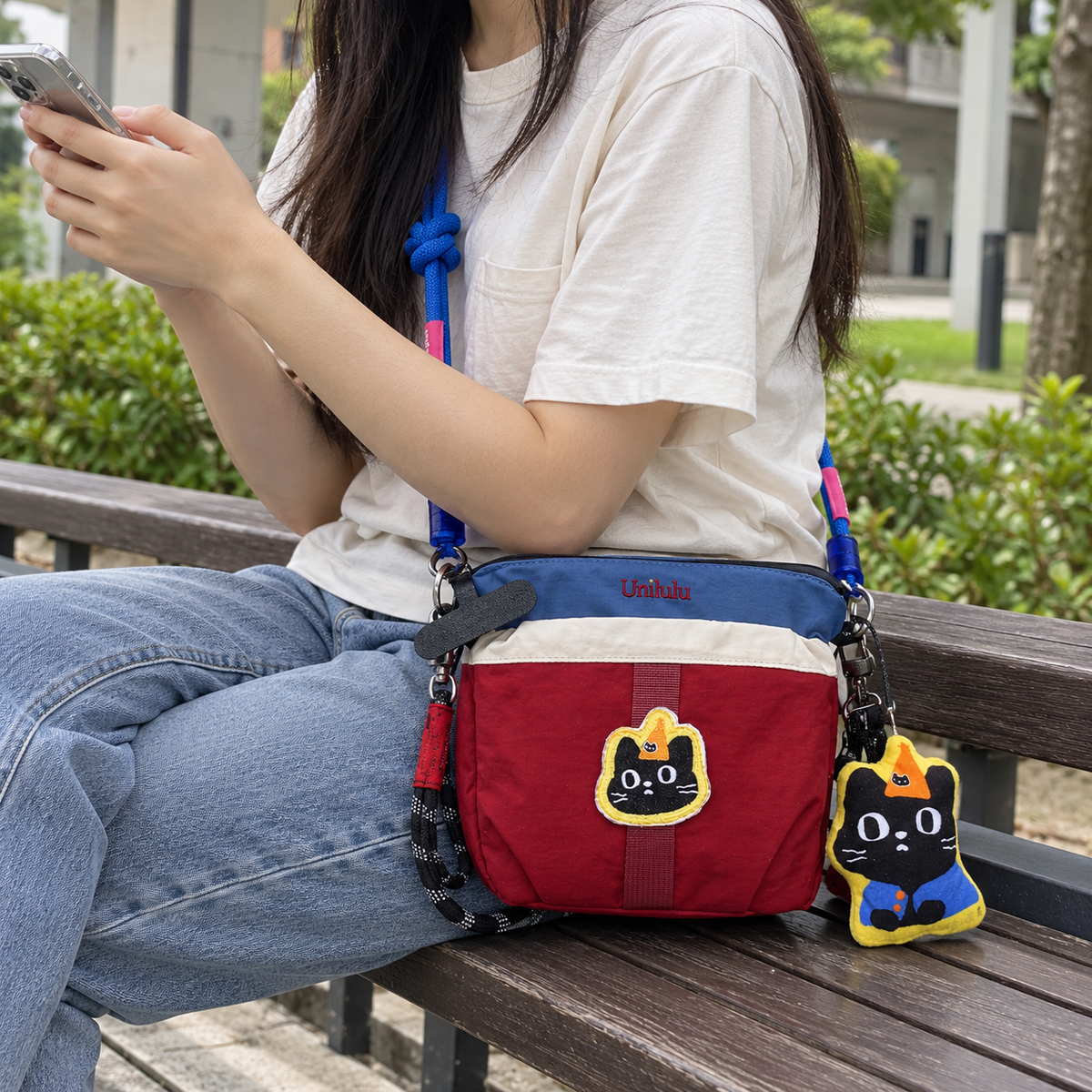 Hawthorn Red sling worn crossbody on campus