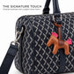 Close-up of metal snap hook and brown horse charm on the navy truffle bag
