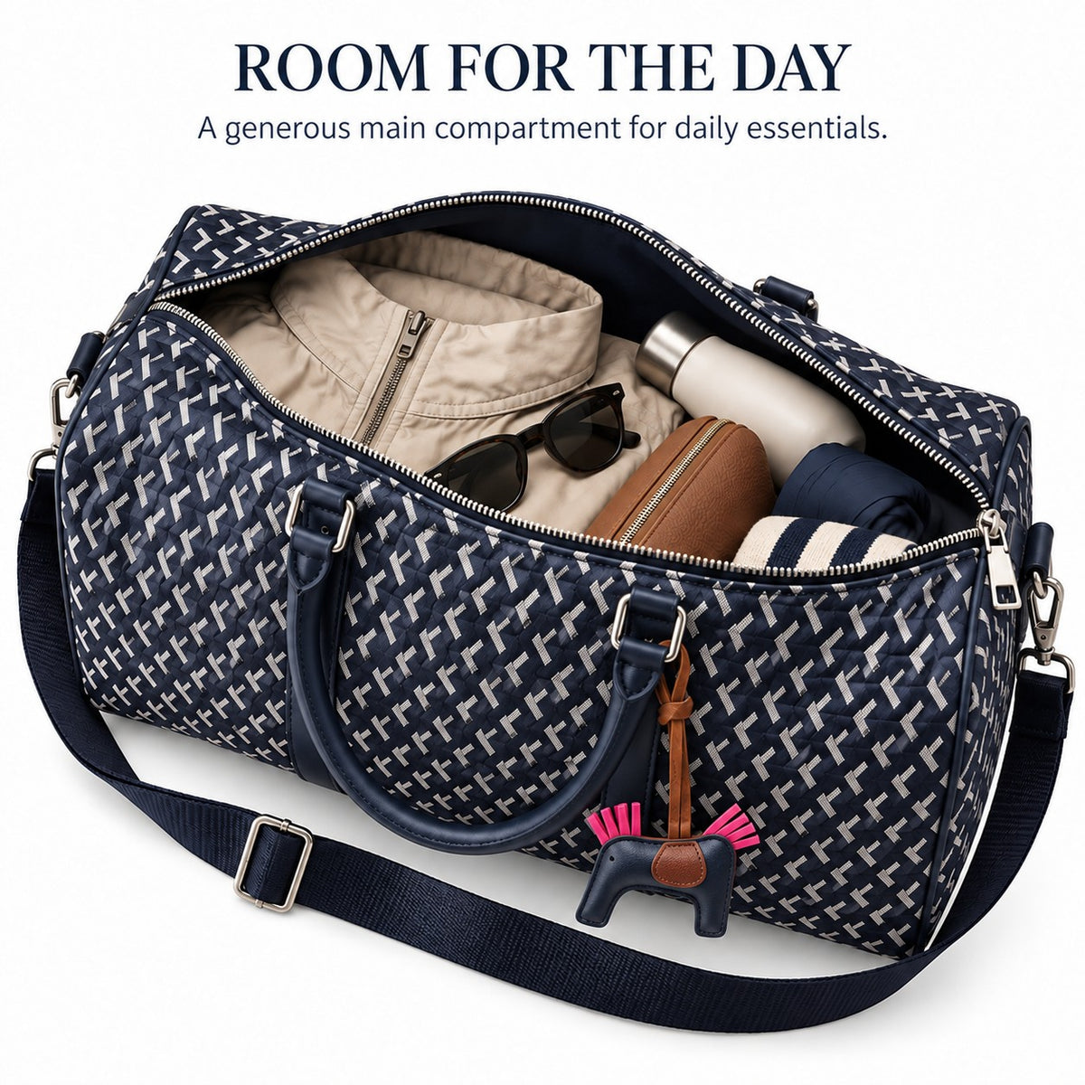 Open main compartment of the truffle bag packed with jacket, bottle and pouch