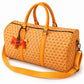 Classic Fly-Horse Truffle Bag in orange with red horse charm and shoulder strap